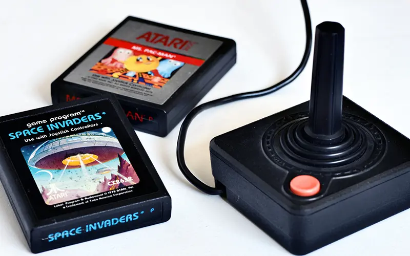 Classic Atari joystick and game cartridges